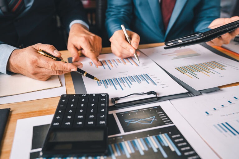business-professionals-reviewing-charts-at-a-table-2026-01-08-02-22-32-utc